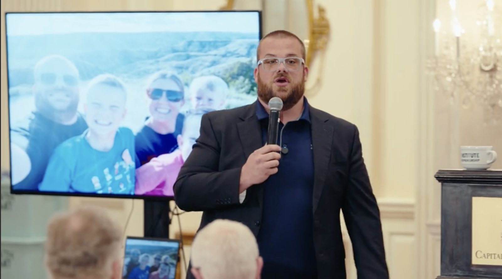 Matthew Efird speaking on stage